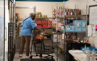 African american woman shopping in the Food Pantries at Senior Communities