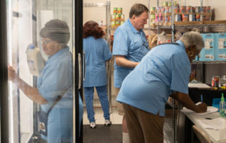 Food Pantries at Senior Communities 3 African american women and one caucasian female working in the pantry.