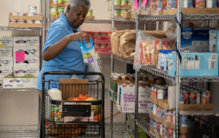 African american woman shopping in Food Pantries at Senior Communities